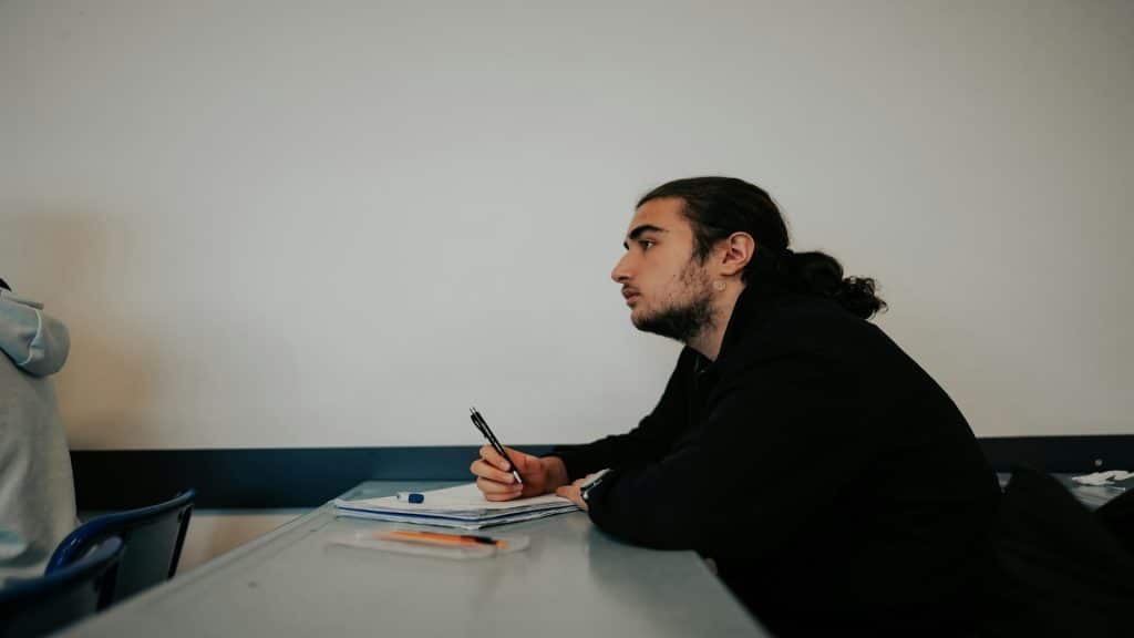 man listening attentively during conversation