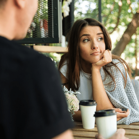 A woman thinking and a man in front of her