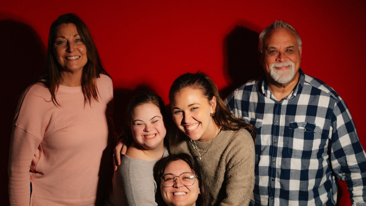 A happy family posing for a picture.