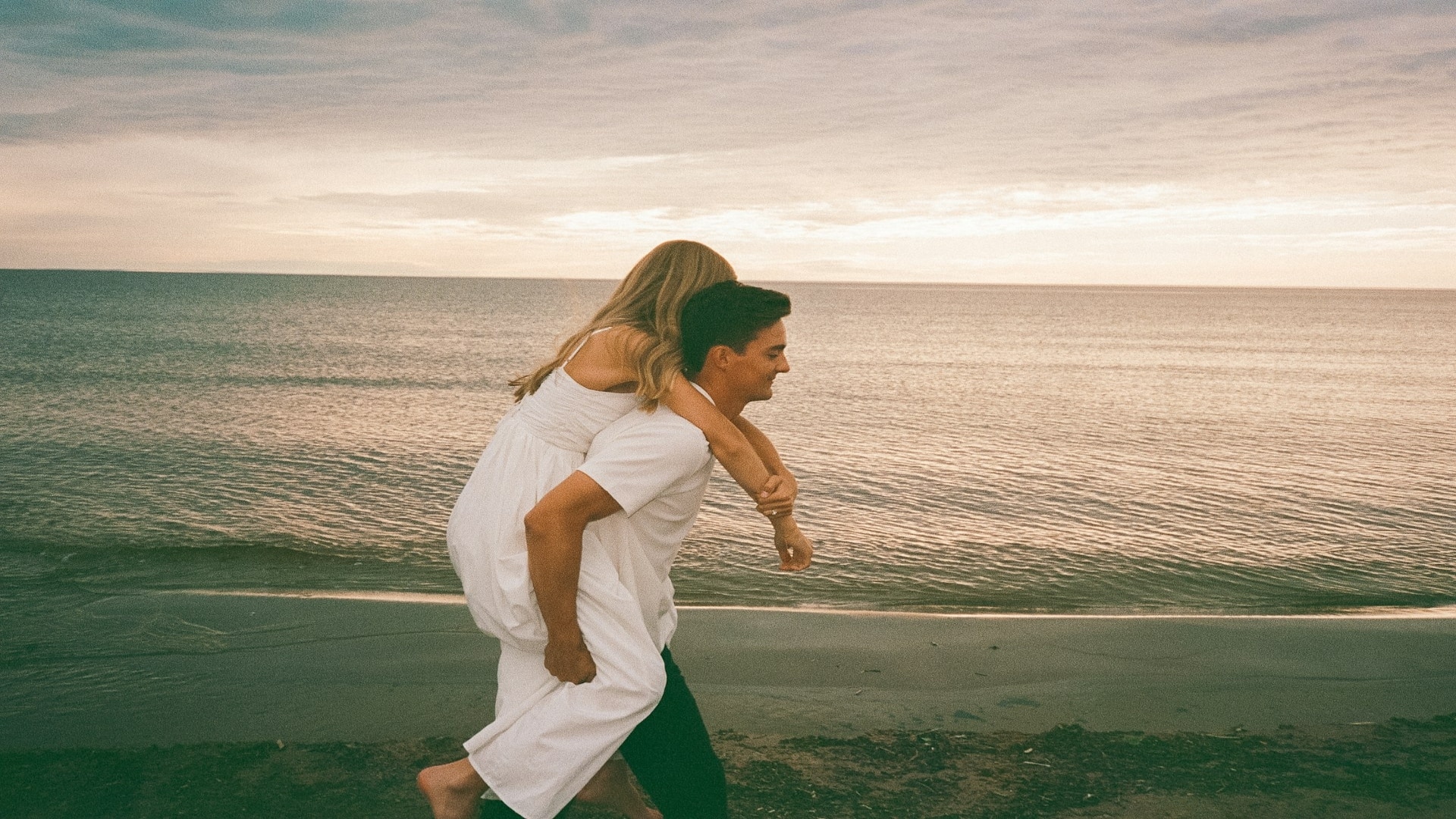couple walking together at sunset