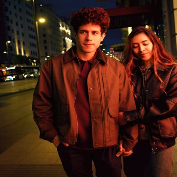 man standing beside partner during evening walk