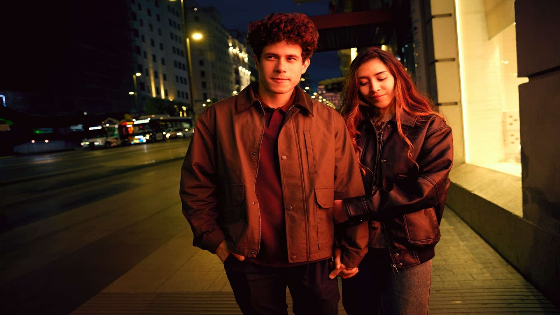 man standing beside partner during evening walk