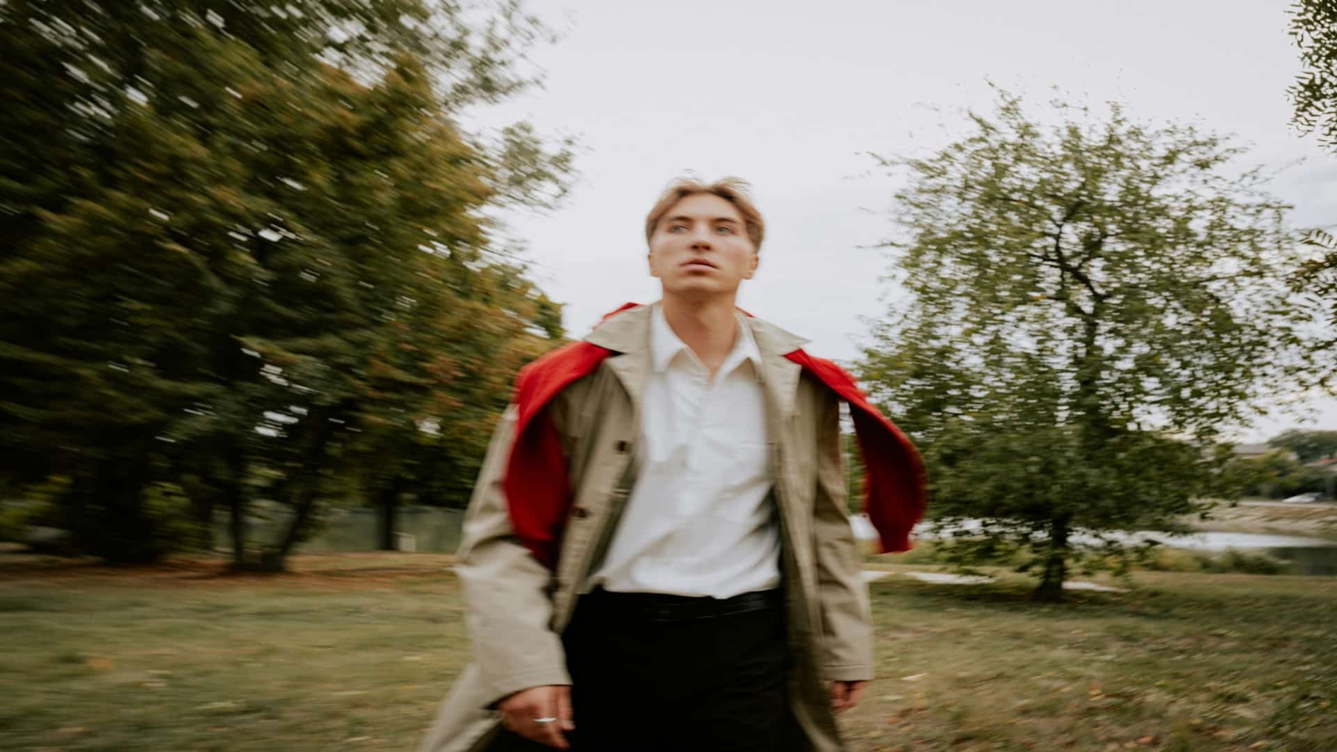 man walking outdoors thinking