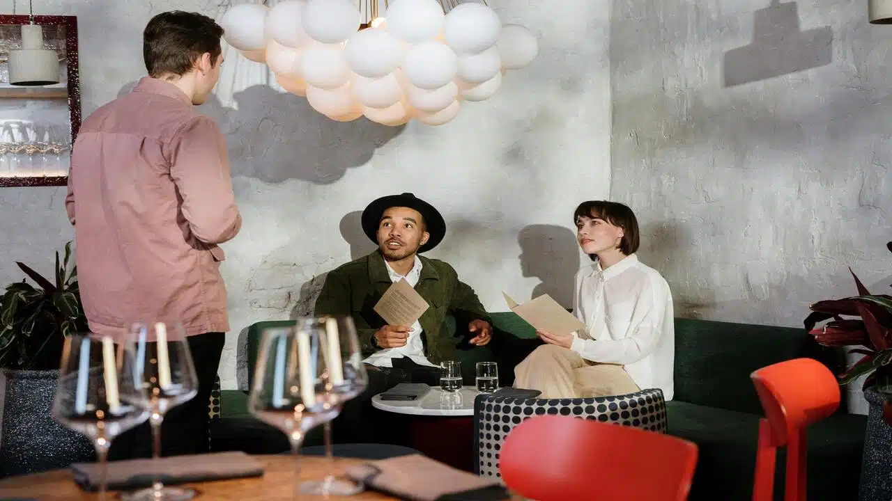 A couple talking to a waiter