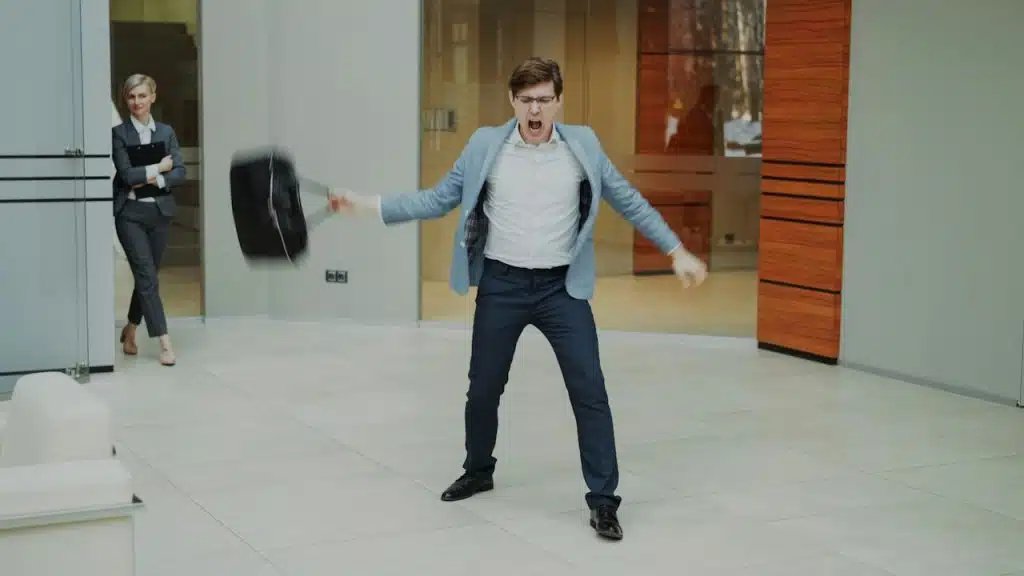 A man is throwing tantrums in the office