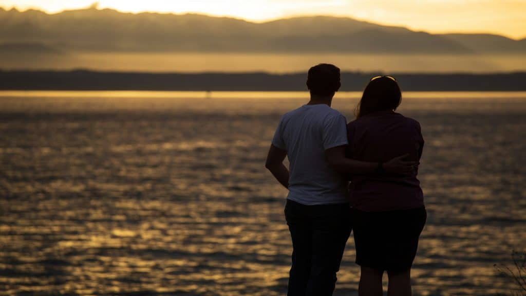 couple watching sunset together