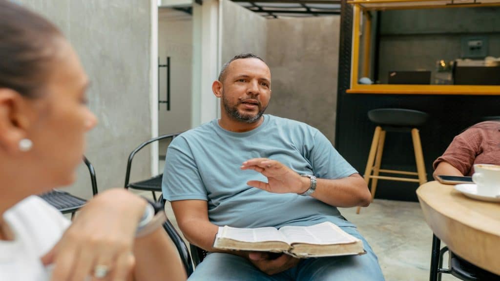 man speaking during conversation