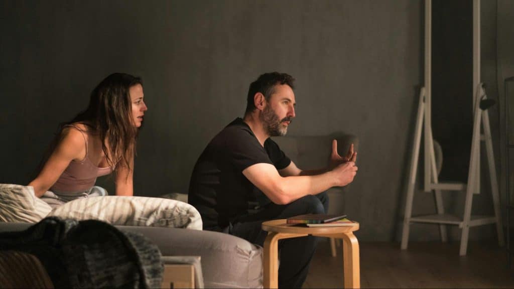 A man explaining to woman