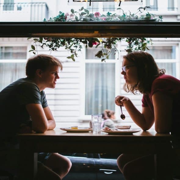 couple having serious conversation indoors