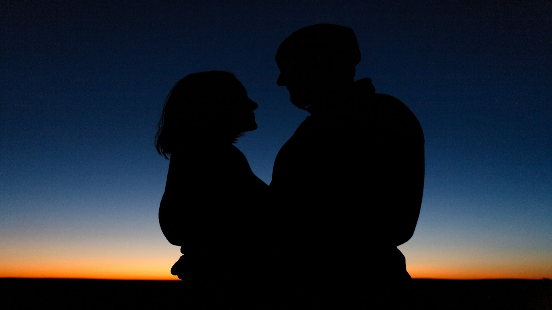 couple watching sunset together