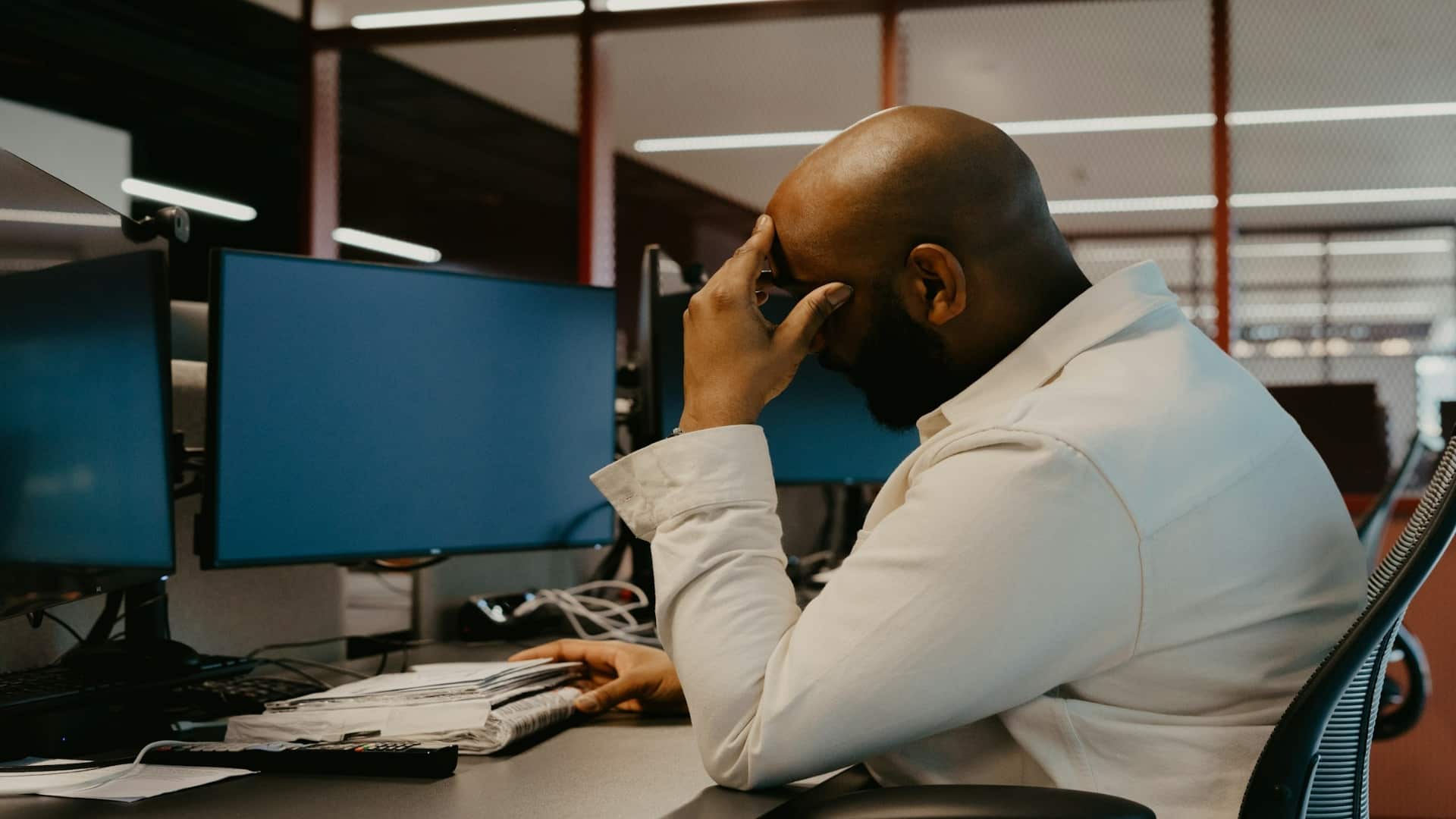 man looking stressed while working