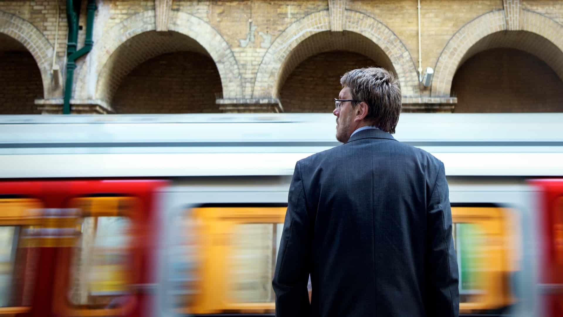 man standing confidently outdoors