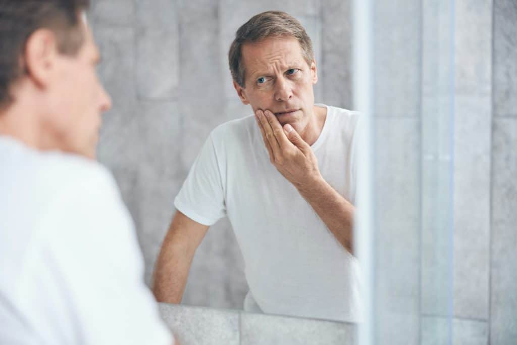 man mirror reflection