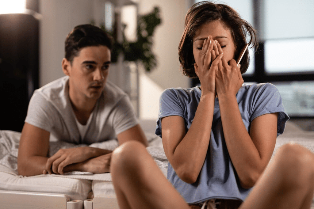 Woman covering her face out of frustration 