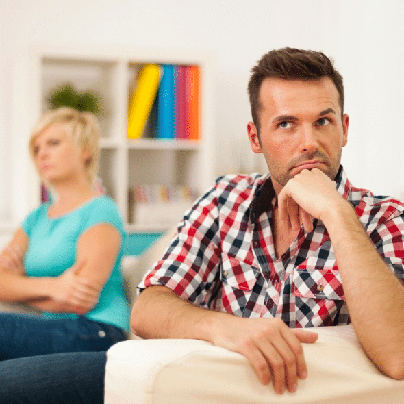 A man thinking while a woman behind him