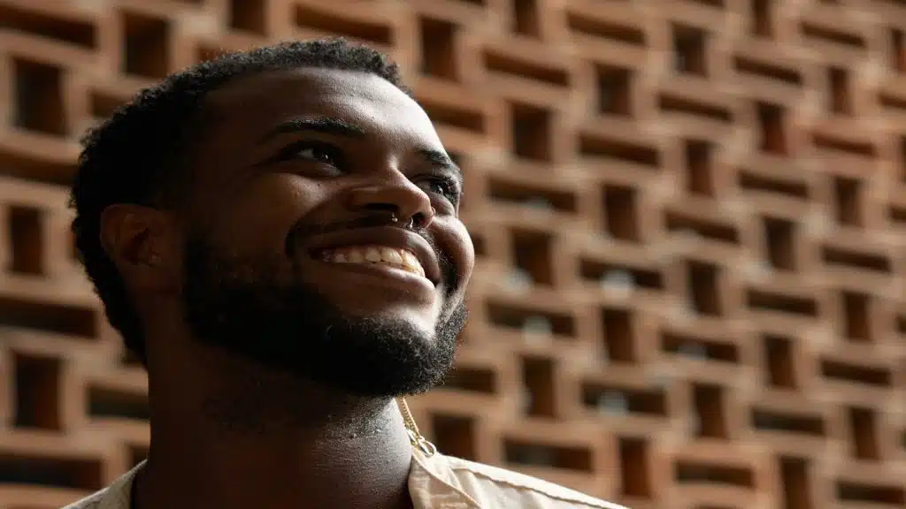 man smiling during conversation