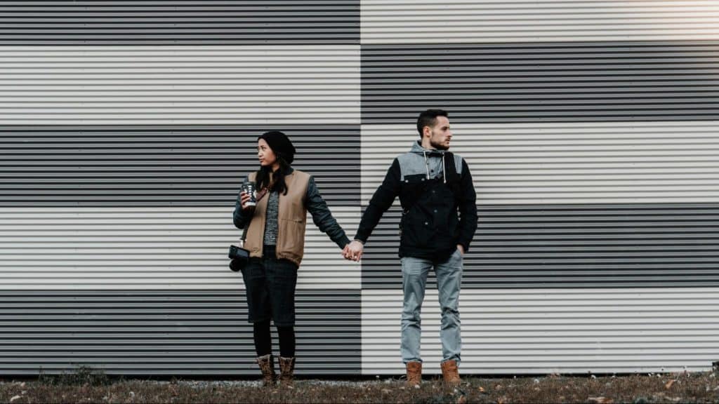 A man and woman holding hands