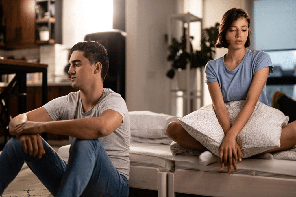 Young couple feeling unhappy in their relationship