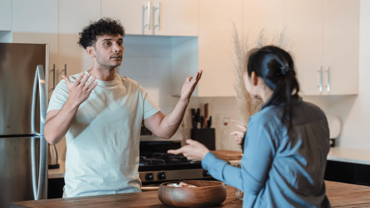 A couple arguing in the kitchen