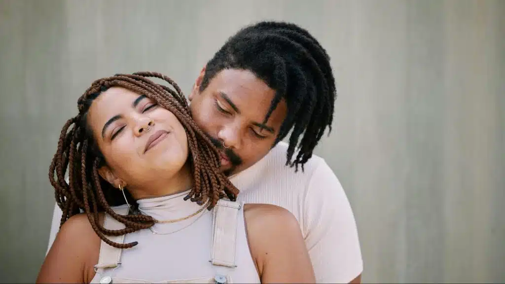A man hugging a woman