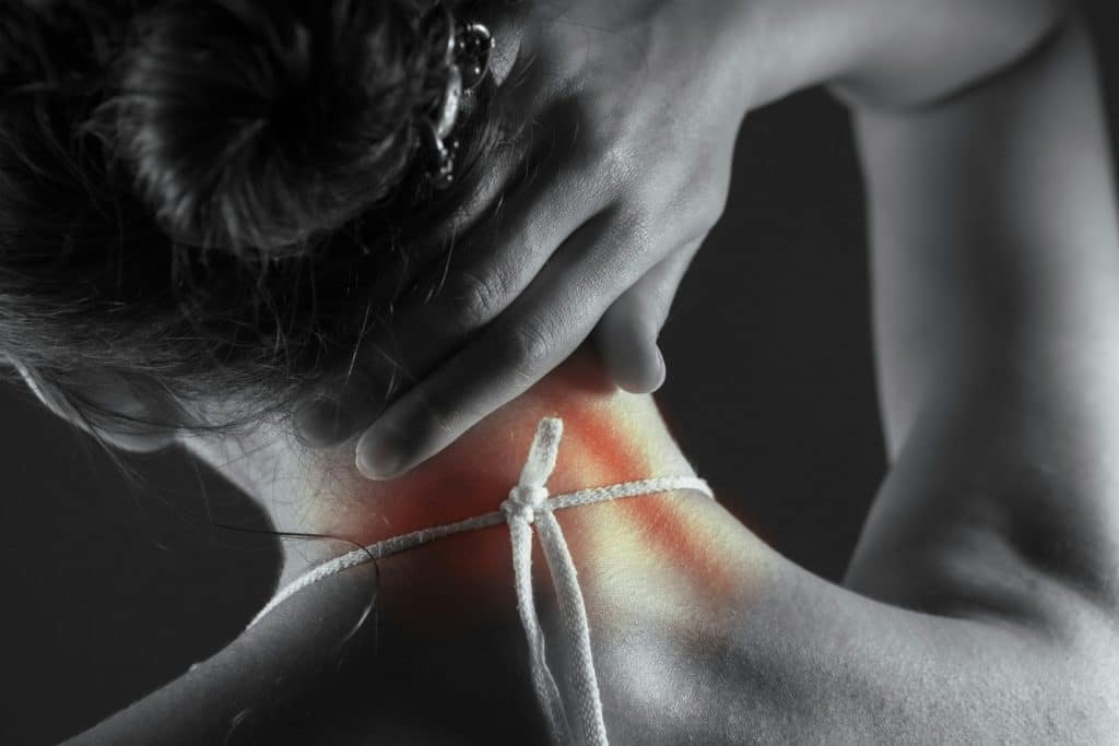 person stretching neck or shoulders