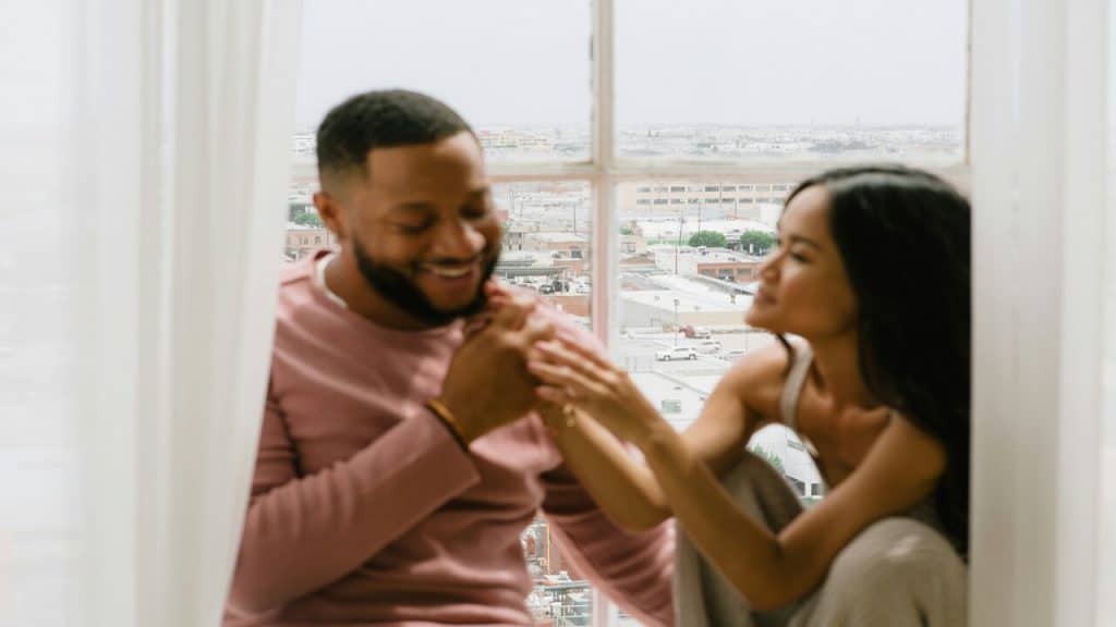 A couple sitting by the window