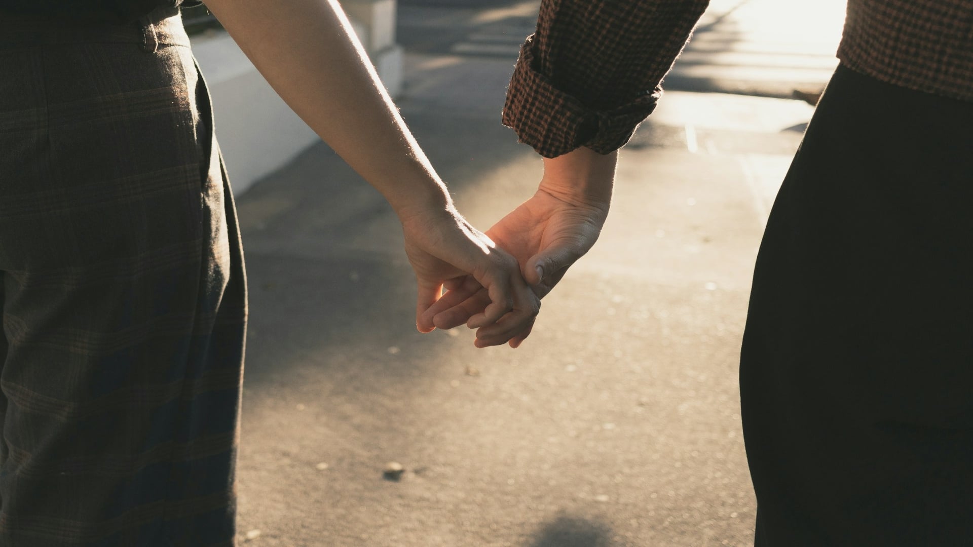 couple holding hands during walk