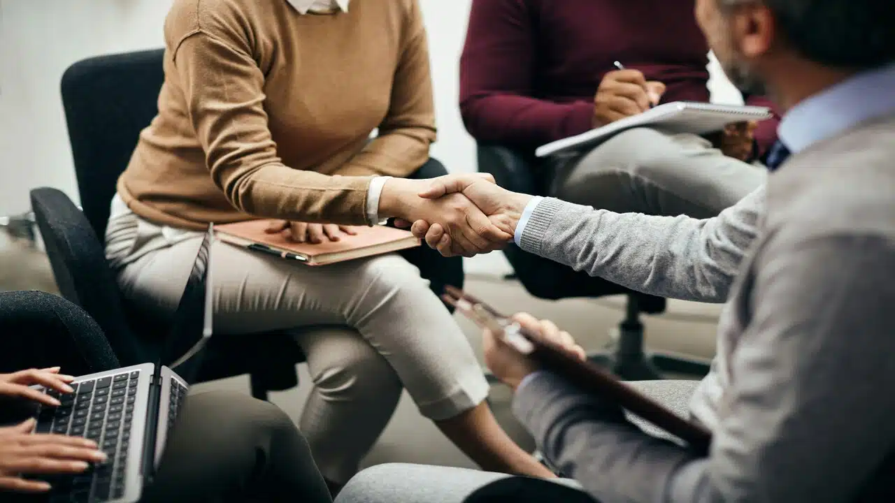 Two colleagues shaking hands