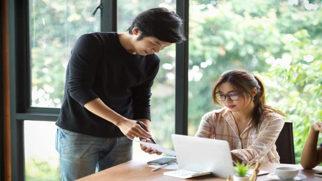 man helping partner with task