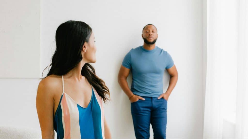 A man and woman looking at each other