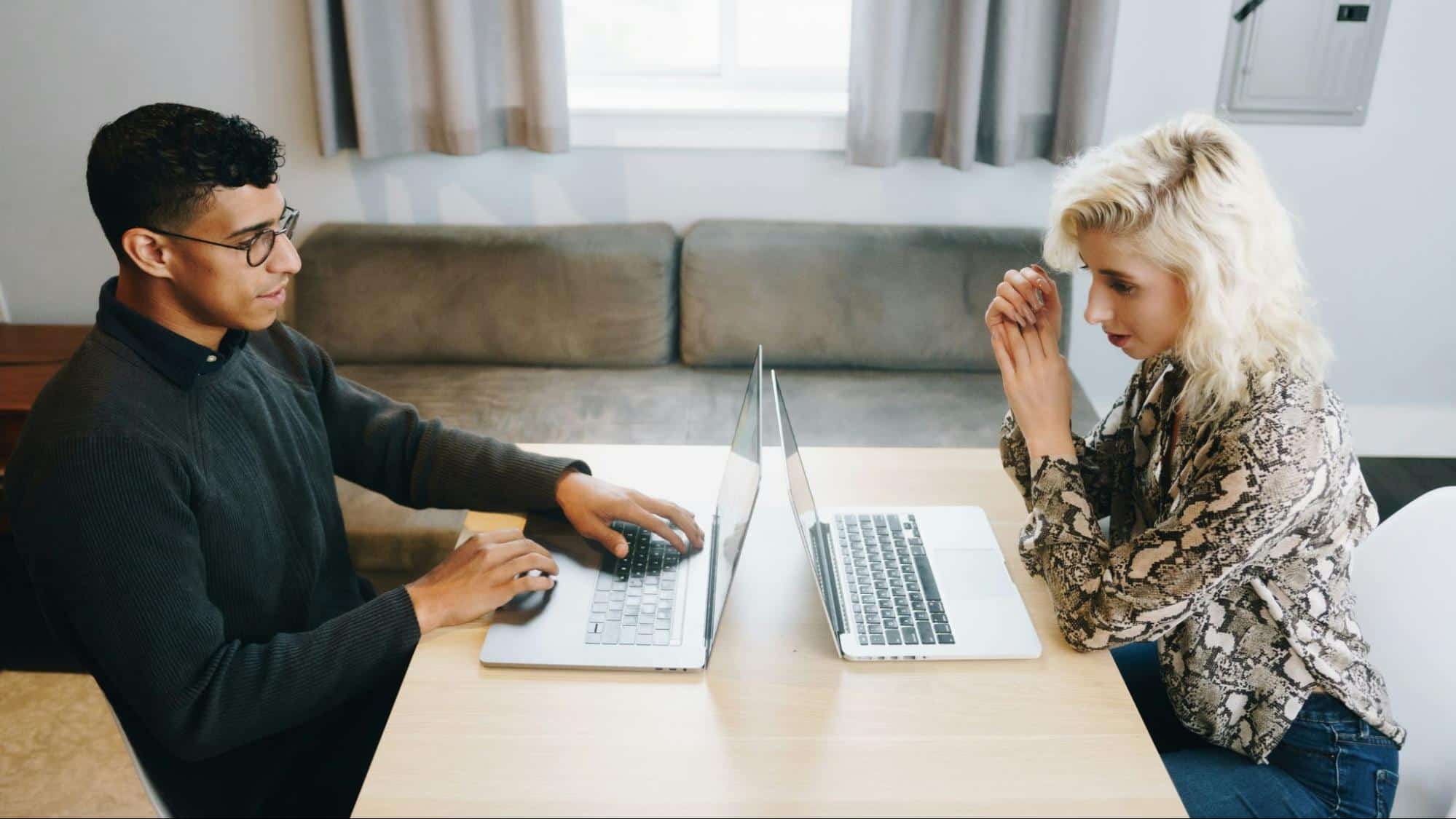 A man and woman busy with their work