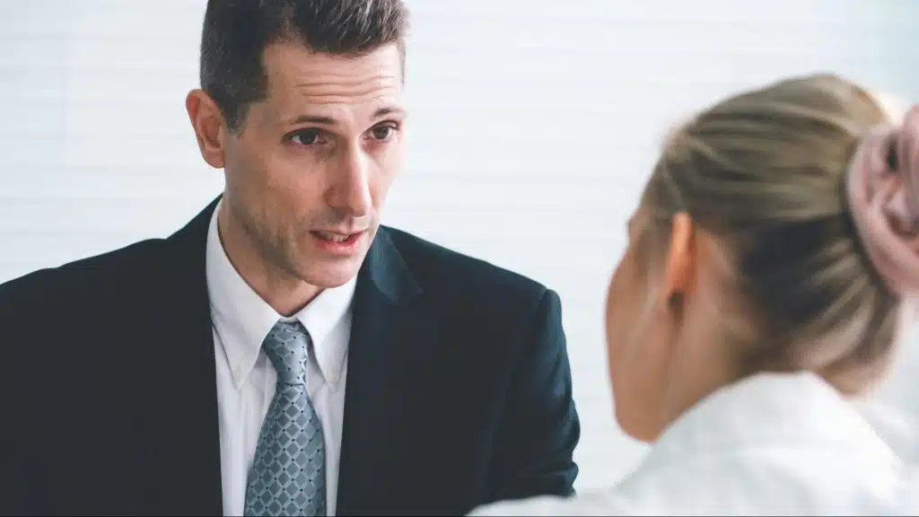 A man talking to a woman