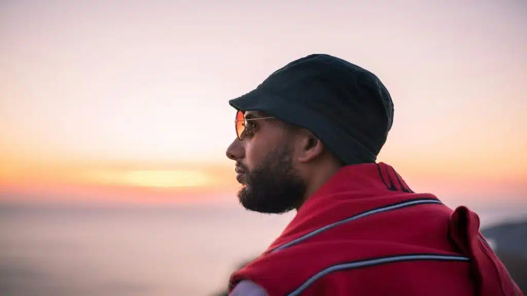 man looking ahead during sunset