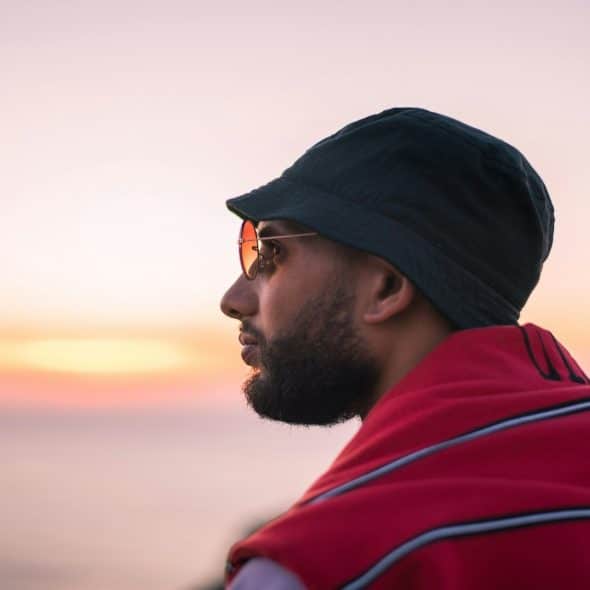 man looking ahead during sunset