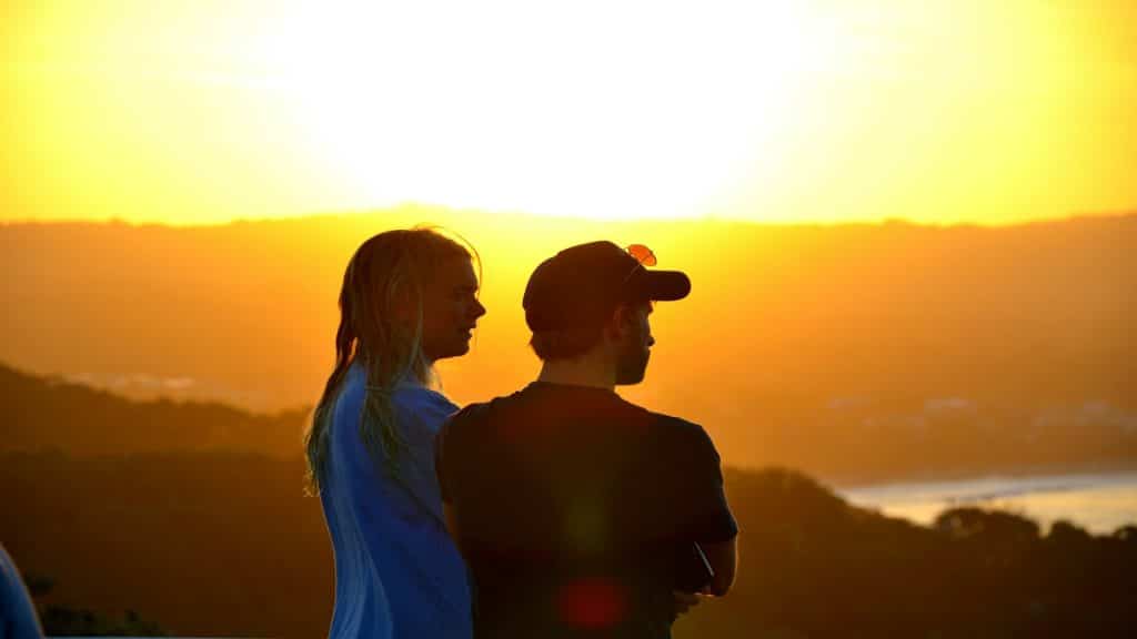 couple watching sunset together