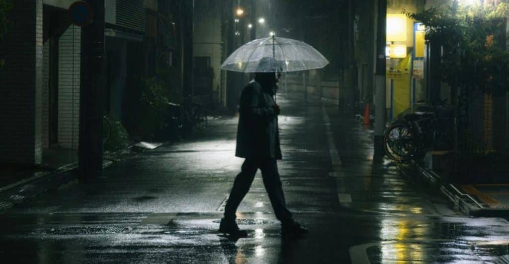 man walking alone city