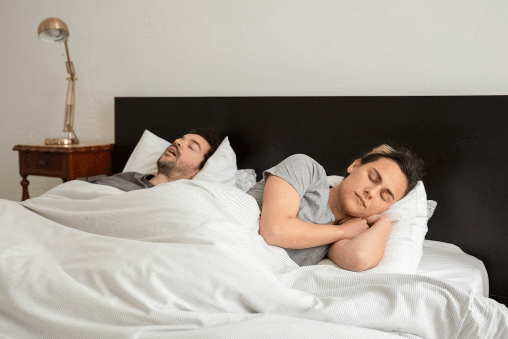 A Couple Sleeping in Bed