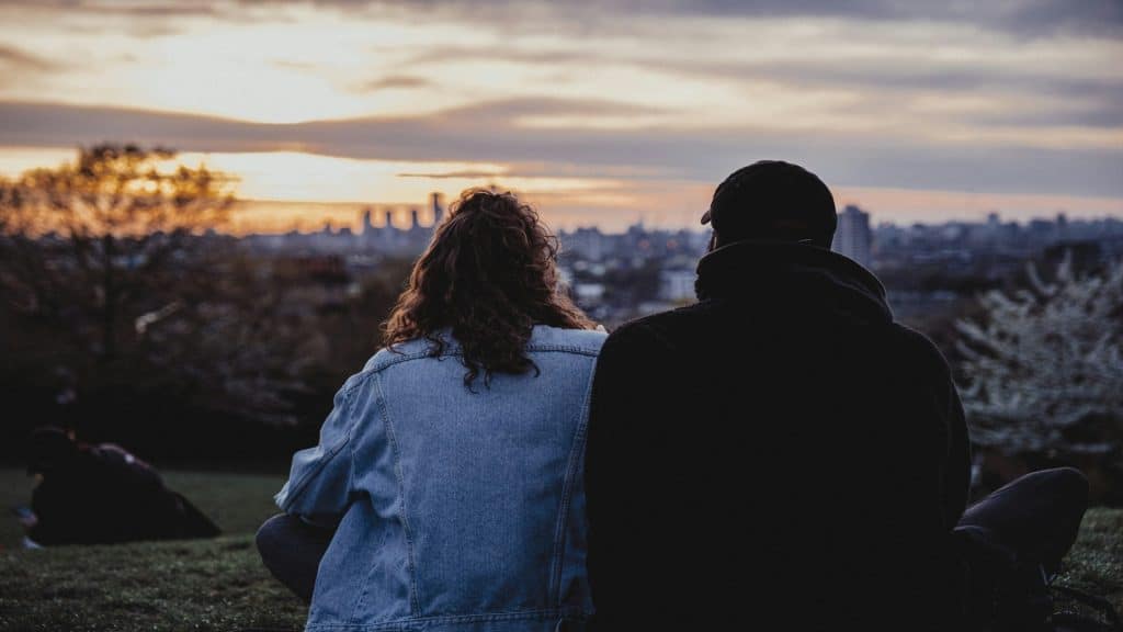 couple watching sunset together