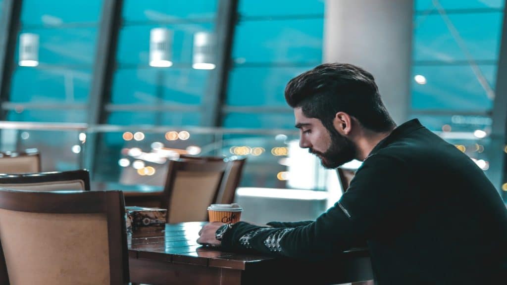 man thinking during conversation