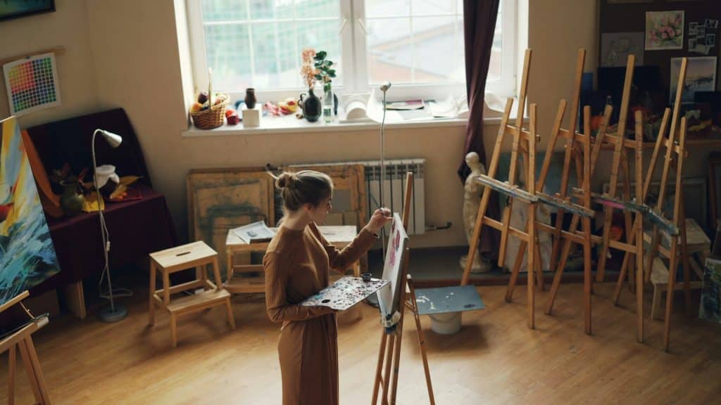 woman painting in art studio