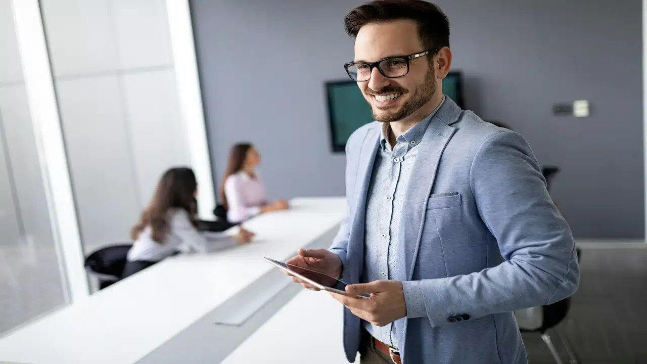 A man smiling while at work