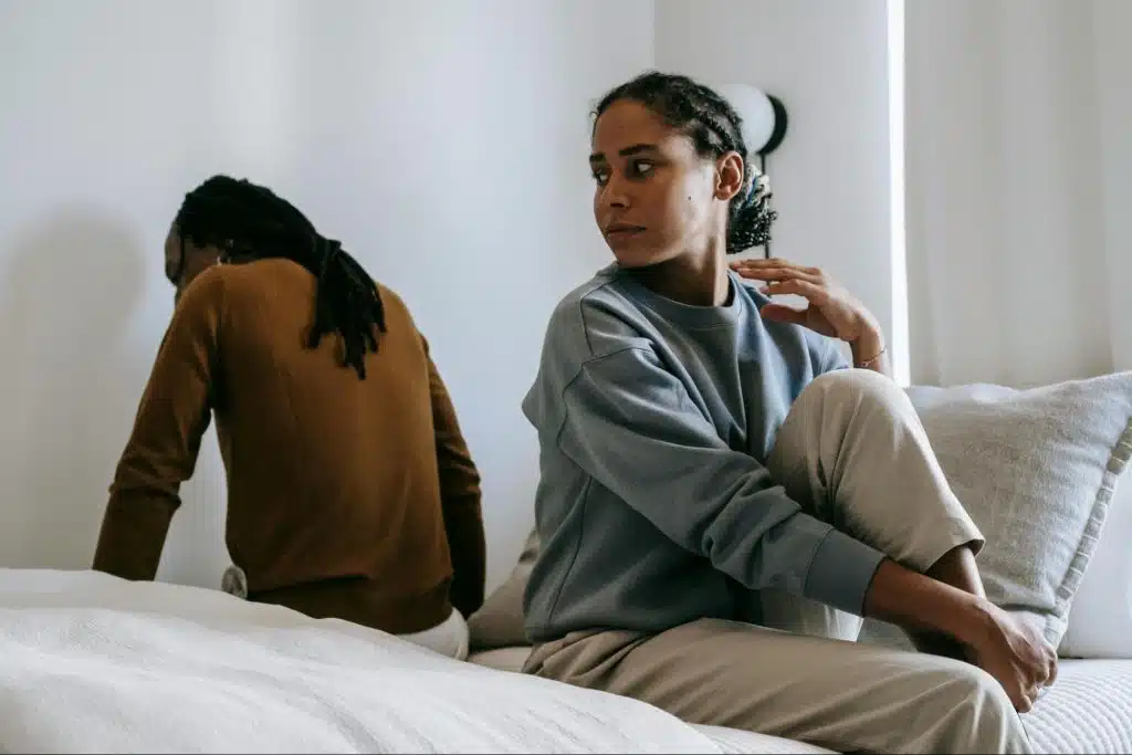 A man turning his back from a woman