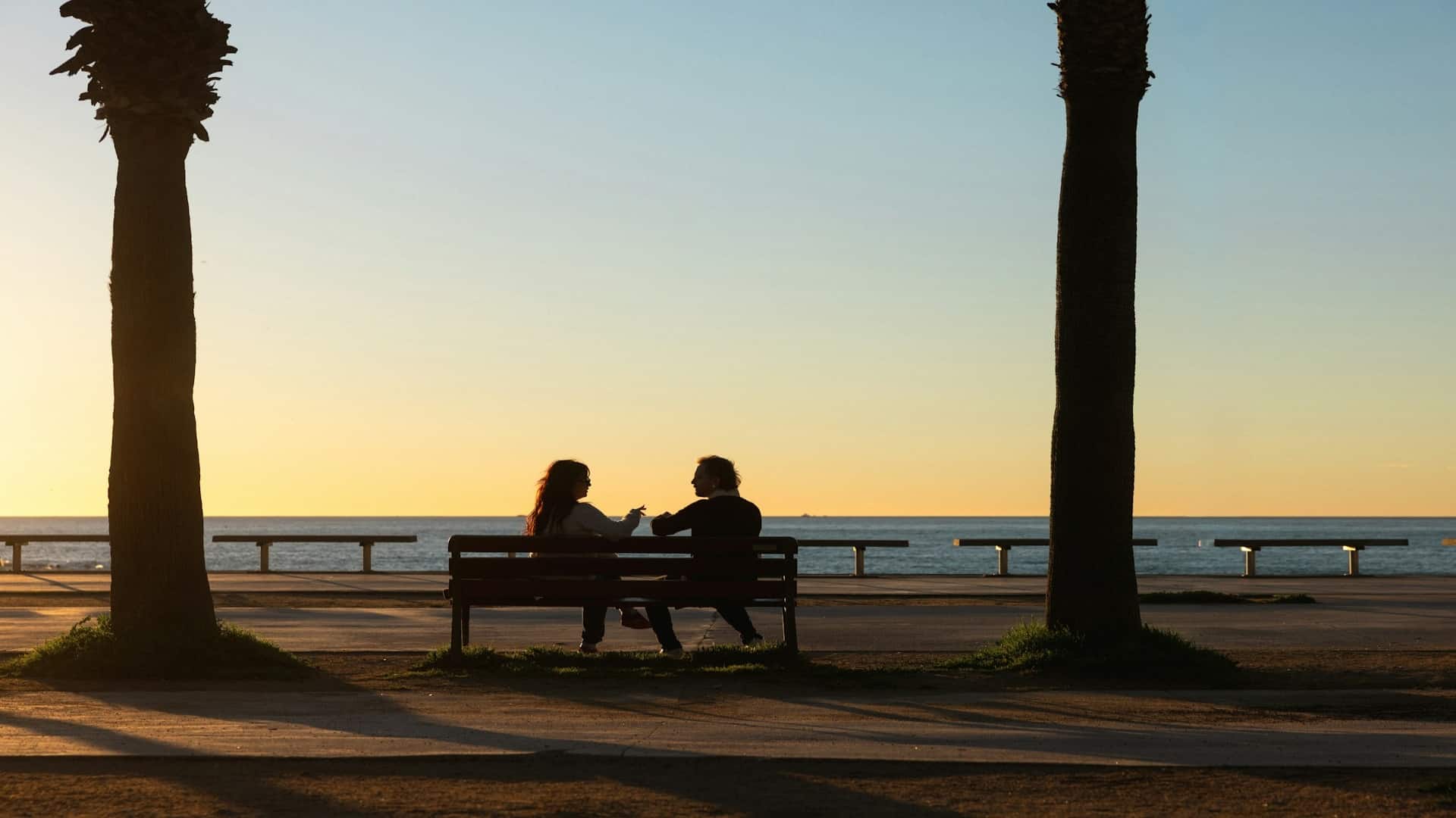 couple watching sunset together