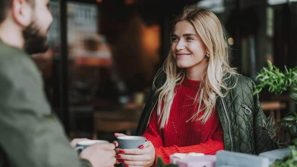 A couple having tea together in a restaurant.