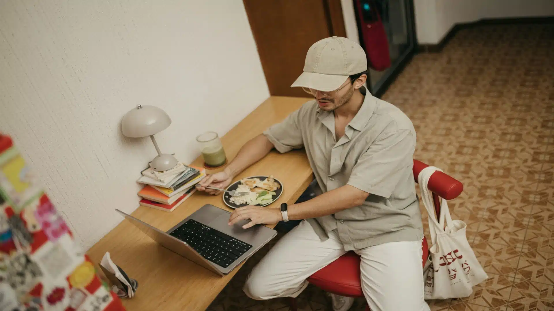 man closing laptop at home
