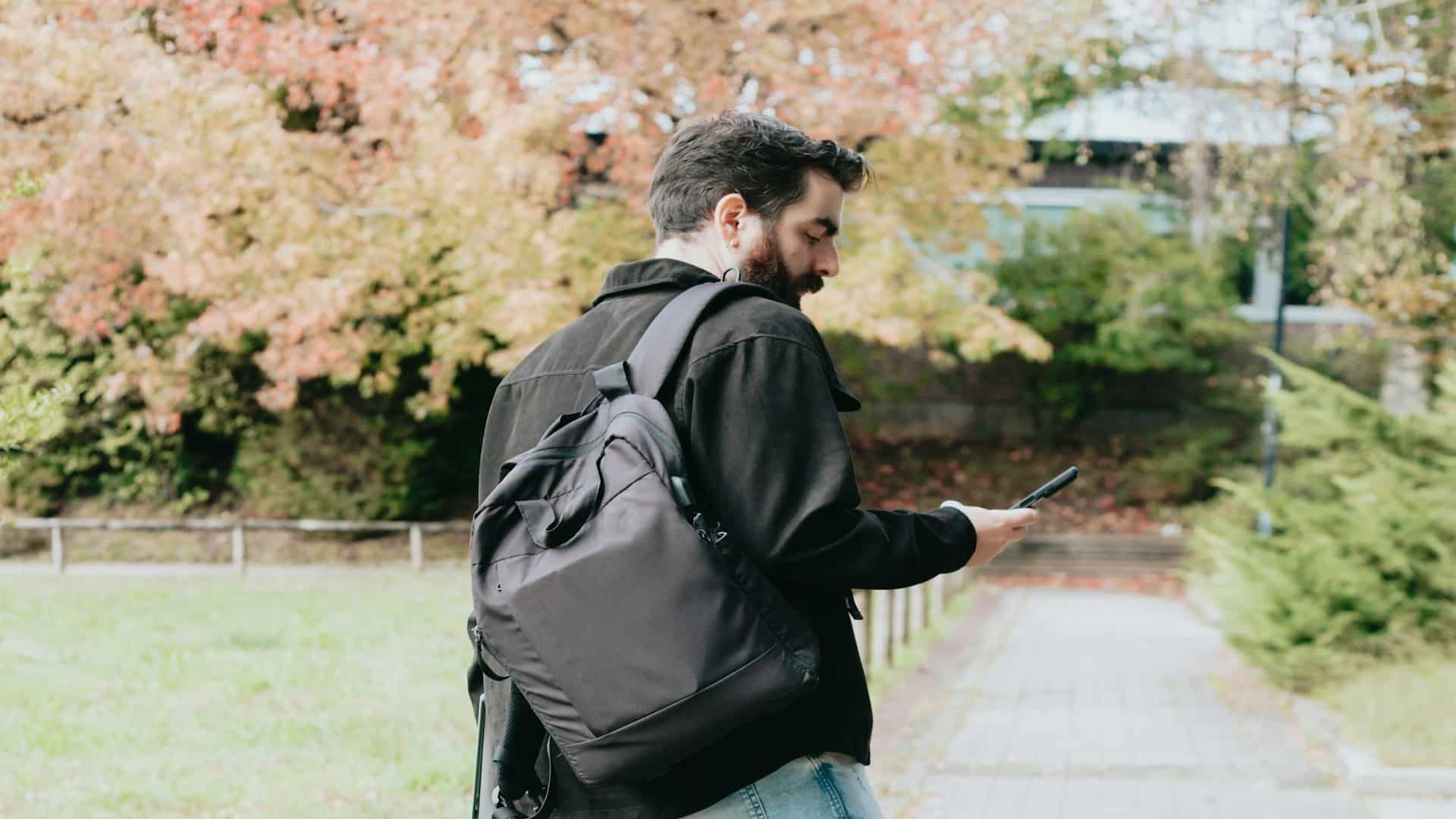 man walking outdoors reflecting