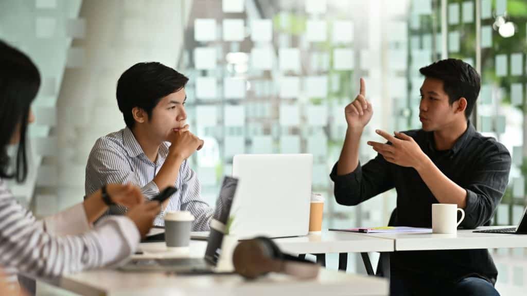 man speaking seriously during conversation