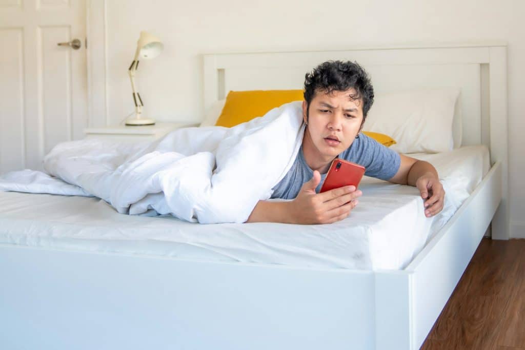 man insomnia bed