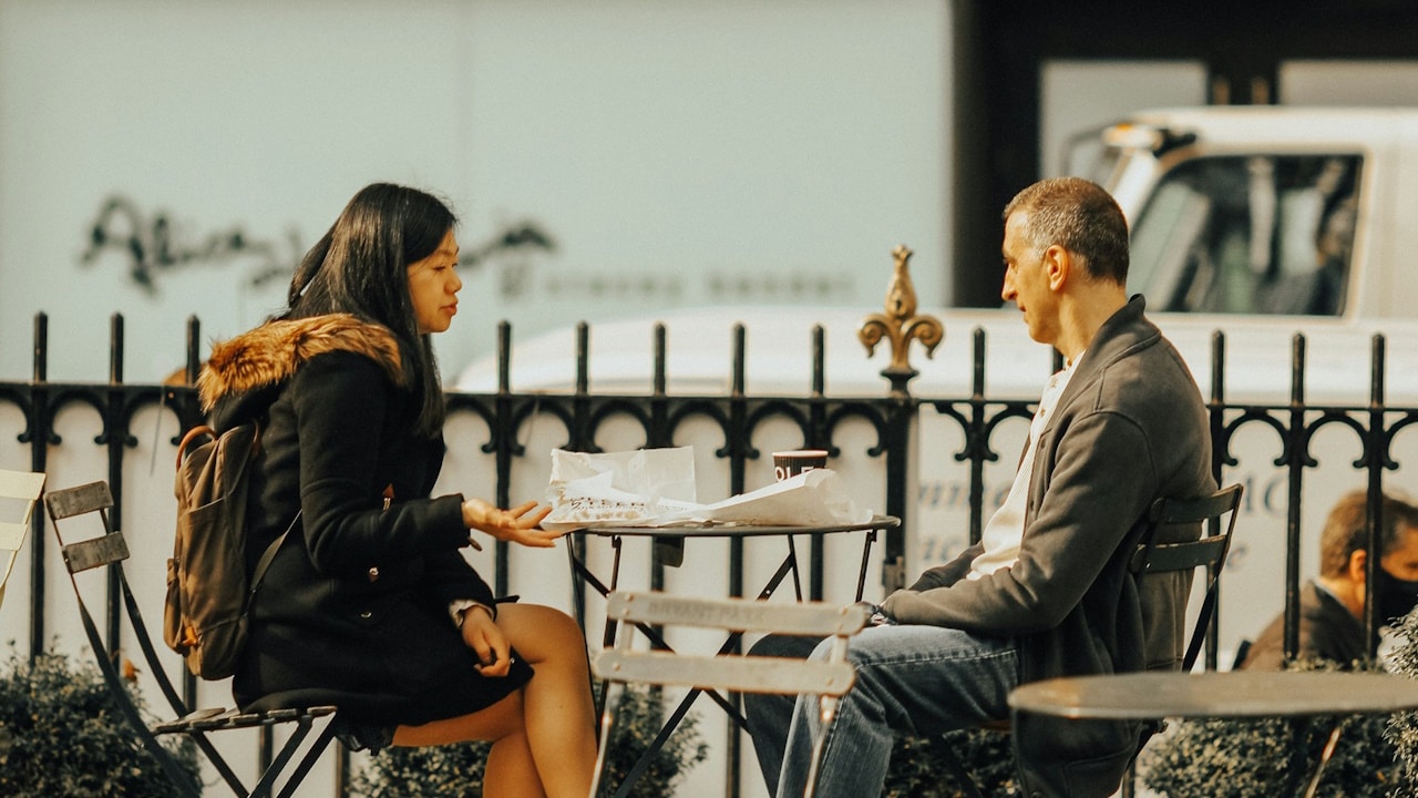 A man and woman at a table.