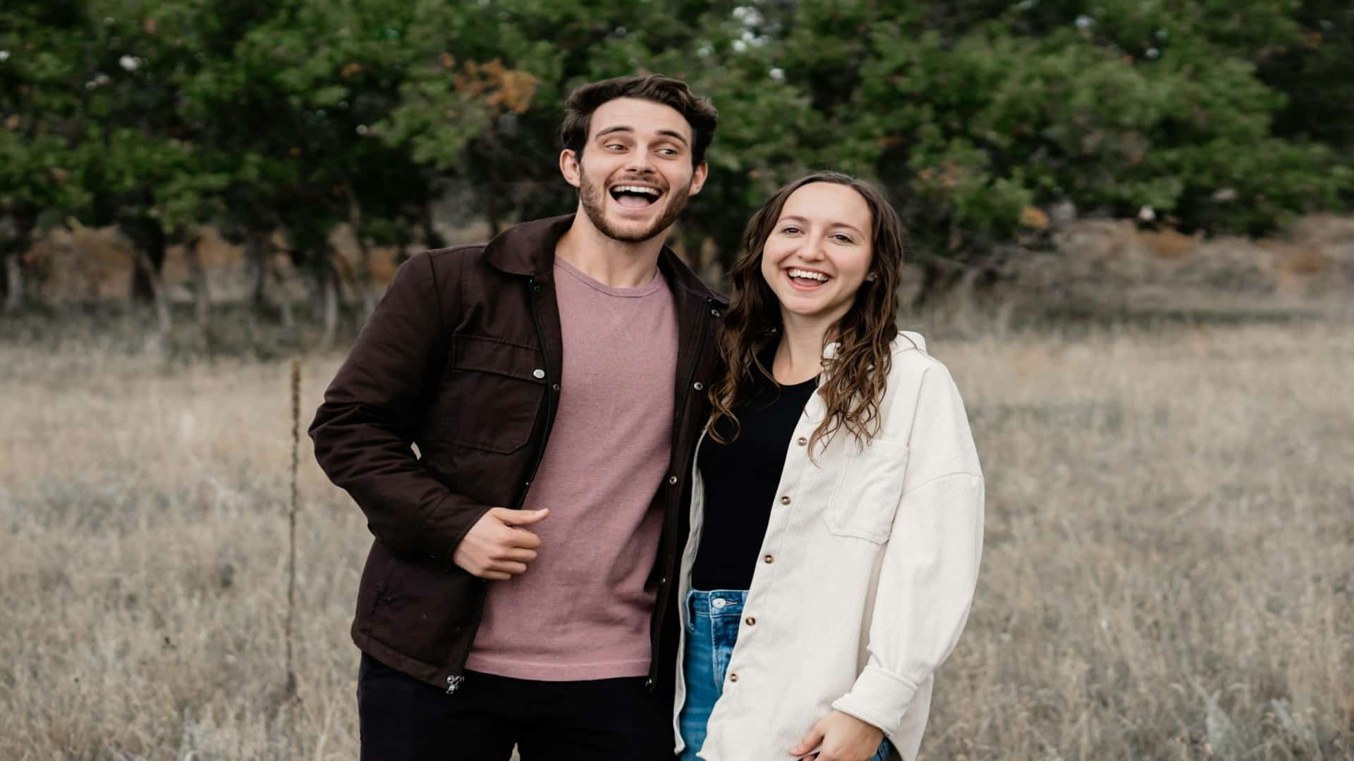 man standing confidently beside partner